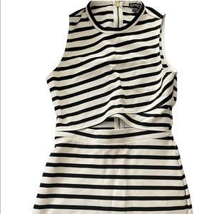 Beautiful Black and White Striped Fitted Dress with Openings in the Midriff.